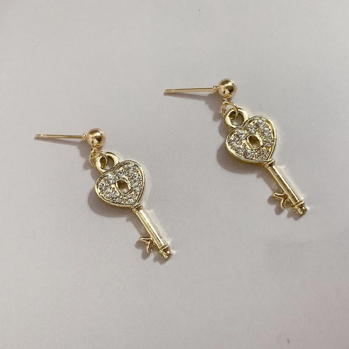 exquisite crystal lock pendant earrings are set with cubic zirconia plated with 14K gold trim designed for women Earrings are for anniversaries birthdays parties jewelry gifts